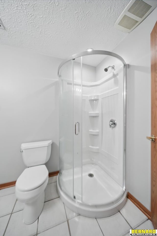 5665 I Rd, Nebraska City, NE 68410 - bathroom with a stall shower, baseboards, toilet, and a textured ceiling