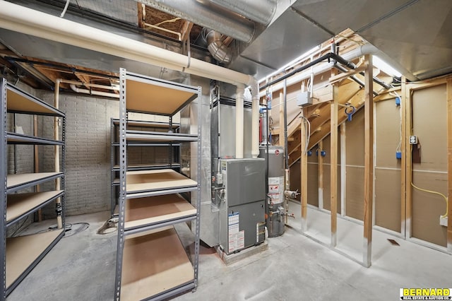 5665 I Rd, Nebraska City, NE 68410 - unfinished basement with water heater, brick wall, and heating unit