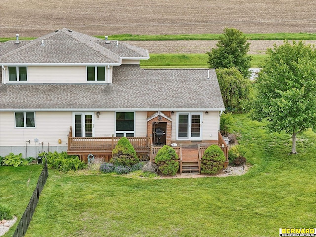 5665 I Rd, Nebraska City, NE 68410 - rear view of house with roof with shingles, a yard, and a wooden deck
