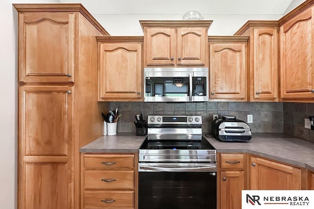 21204 Hampton Dr, Gretna, NE 68028 - kitchen featuring appliances with stainless steel finishes, tasteful backsplash, and dark countertops