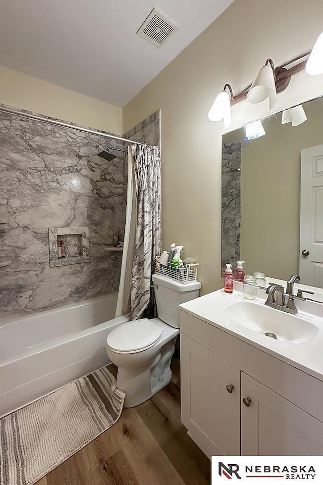 21204 Hampton Dr, Gretna, NE 68028 - full bathroom with wood finished floors, toilet, vanity, and shower / bath combo with shower curtain
