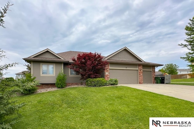 21204 Hampton Dr, Gretna, NE 68028 - view of front of property featuring concrete driveway, a garage, a front lawn, and brick siding
