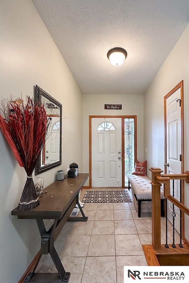21204 Hampton Dr, Gretna, NE 68028 - entrance foyer with a textured ceiling and light tile patterned floors