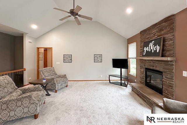 21204 Hampton Dr, Gretna, NE 68028 - living area featuring ceiling fan, carpet floors, a stone fireplace, baseboards, and high vaulted ceiling