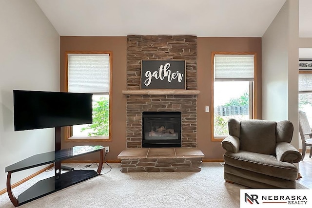 21204 Hampton Dr, Gretna, NE 68028 - living room featuring carpet flooring, healthy amount of natural light, a fireplace, vaulted ceiling, and baseboards