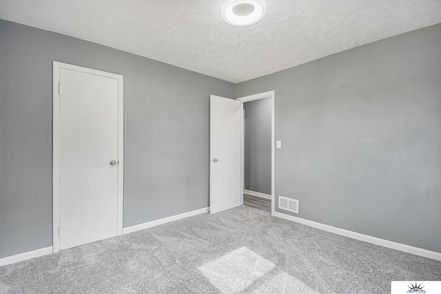 3810 Corby St, Omaha, NE 68111 - unfurnished bedroom with carpet, a textured ceiling, and baseboards