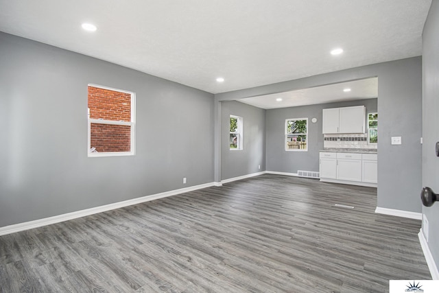 3810 Corby St, Omaha, NE 68111 - unfurnished living room featuring wood finished floors, baseboards, and recessed lighting