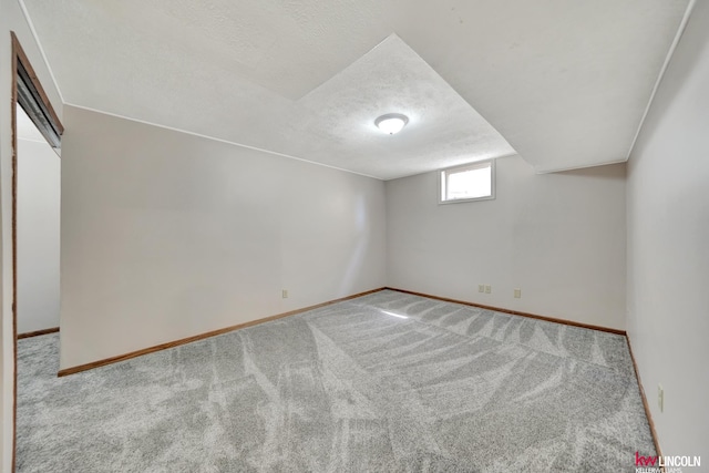 235 W Belmont Ave, Lincoln, NE 68521 - bonus room featuring carpet flooring, a textured ceiling, and baseboards