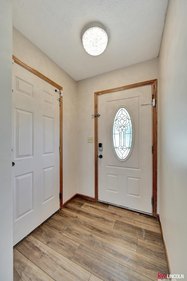 235 W Belmont Ave, Lincoln, NE 68521 - foyer with light wood-type flooring and baseboards