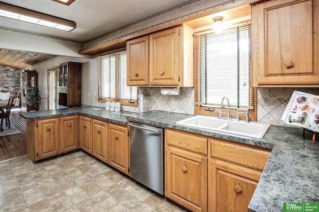 9706 N 51st St, Omaha, NE 68152 - kitchen featuring a sink, dishwasher, a peninsula, plenty of natural light, and crown molding