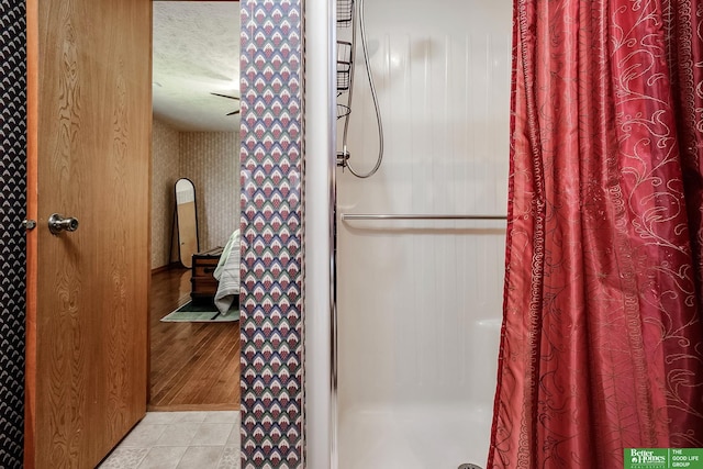 9706 N 51st St, Omaha, NE 68152 - full bath featuring a shower with curtain and a textured ceiling