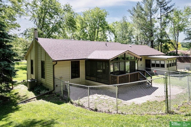 9706 N 51st St, Omaha, NE 68152 - back of property with a shingled roof, a sunroom, a chimney, and central AC unit