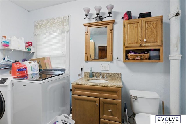 453 W 4th St, Wahoo, NE 68066 - bathroom with independent washer and dryer, vanity, and toilet