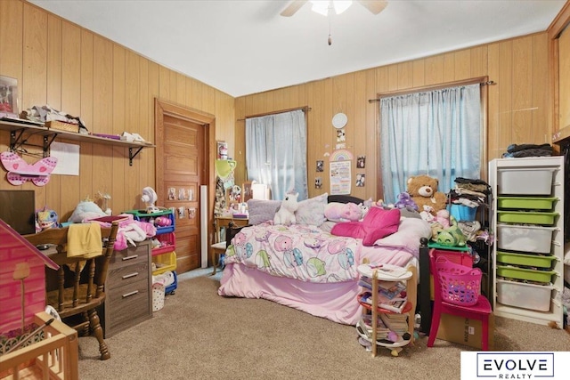 453 W 4th St, Wahoo, NE 68066 - bedroom featuring carpet, wooden walls, and ceiling fan