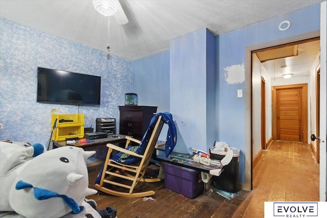 453 W 4th St, Wahoo, NE 68066 - living area with wallpapered walls, wood-type flooring, and attic access