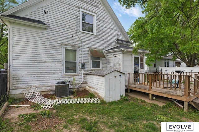 453 W 4th St, Wahoo, NE 68066 - rear view of property with a wooden deck and central AC unit