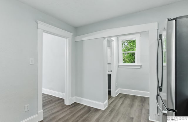 2909 N 26th St, Omaha, NE 68111 - foyer entrance featuring wood finished floors and baseboards