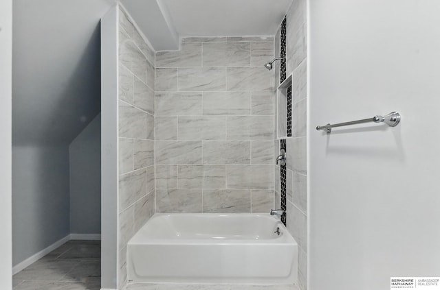 2909 N 26th St, Omaha, NE 68111 - bathroom featuring shower / tub combination and baseboards