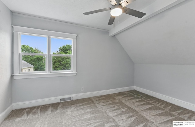 2909 N 26th St, Omaha, NE 68111 - bonus room featuring carpet, vaulted ceiling, baseboards, and a ceiling fan