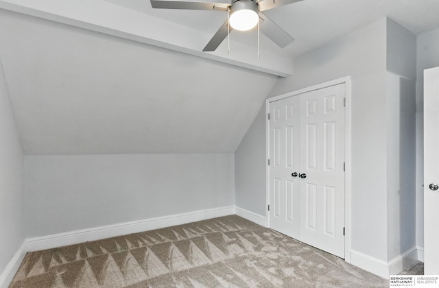 2909 N 26th St, Omaha, NE 68111 - additional living space with carpet floors, vaulted ceiling, baseboards, and a ceiling fan