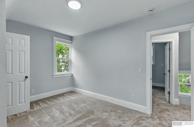 2909 N 26th St, Omaha, NE 68111 - unfurnished bedroom with carpet and baseboards