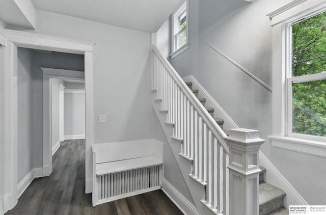 2909 N 26th St, Omaha, NE 68111 - staircase with wood finished floors and baseboards