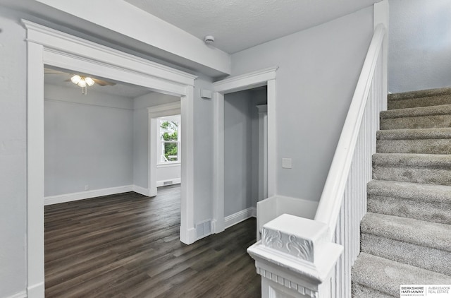 2909 N 26th St, Omaha, NE 68111 - stairs featuring wood finished floors, baseboards, and a ceiling fan