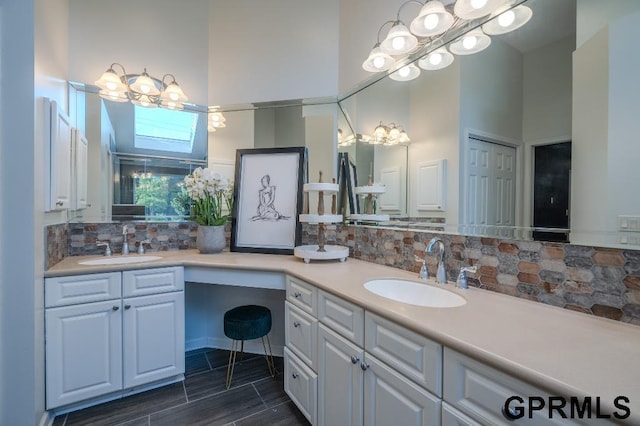 15931 Yates St, Omaha, NE 68116 - bathroom featuring double vanity and tasteful backsplash