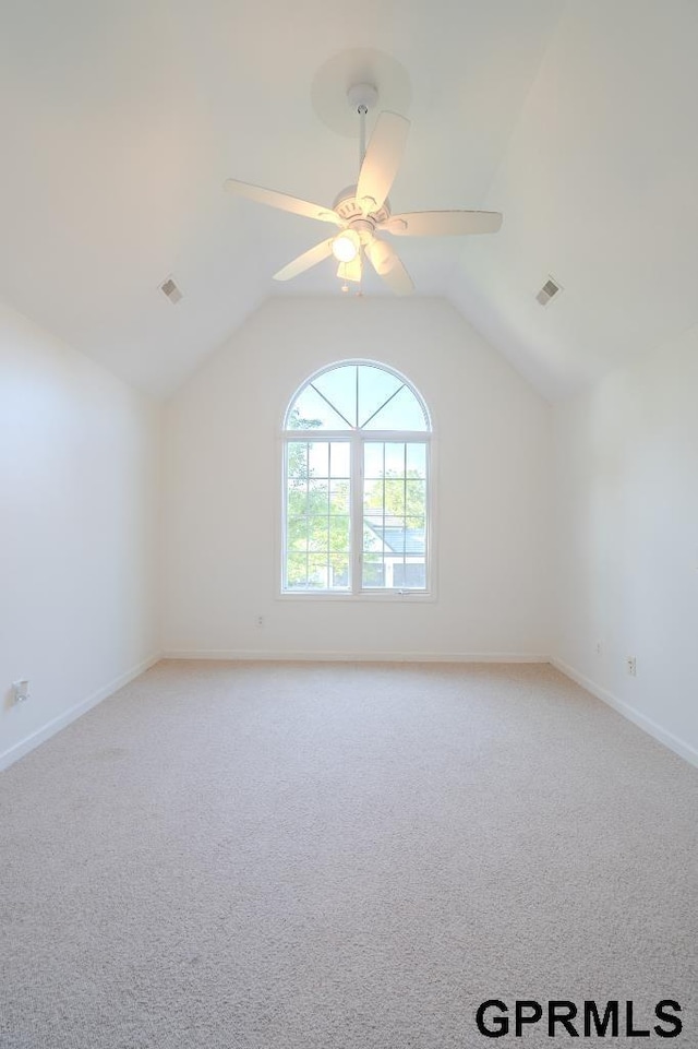 15931 Yates St, Omaha, NE 68116 - additional living space featuring light carpet, ceiling fan, vaulted ceiling, and baseboards