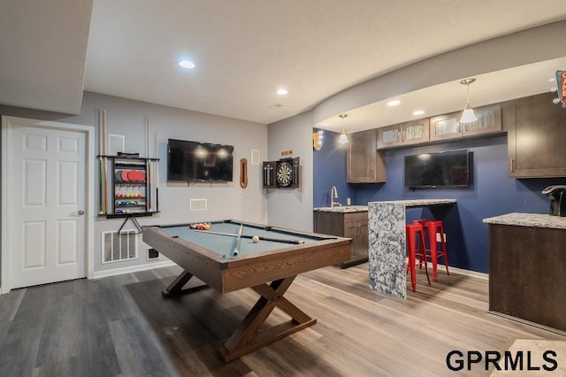 15931 Yates St, Omaha, NE 68116 - playroom featuring wood finished floors, wet bar, billiards table, baseboards, and recessed lighting