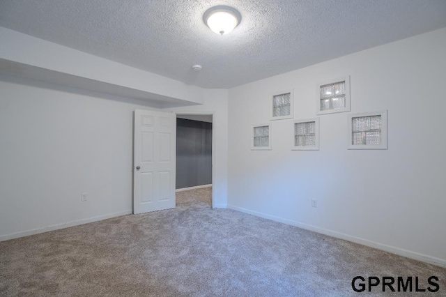15931 Yates St, Omaha, NE 68116 - carpeted spare room featuring a textured ceiling and baseboards