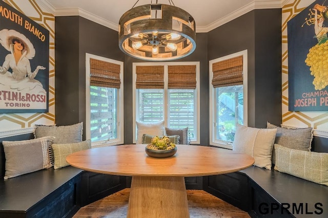 15931 Yates St, Omaha, NE 68116 - dining room featuring breakfast area, healthy amount of natural light, wood finished floors, and crown molding