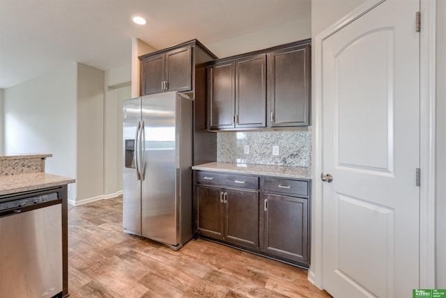 4604 Hansen Ave, Papillion, NE 68133 - kitchen featuring stainless steel appliances, dark brown cabinetry, light wood-style floors, tasteful backsplash, and recessed lighting