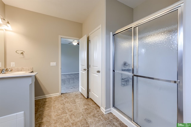 4604 Hansen Ave, Papillion, NE 68133 - bathroom featuring vanity, a stall shower, a ceiling fan, and baseboards