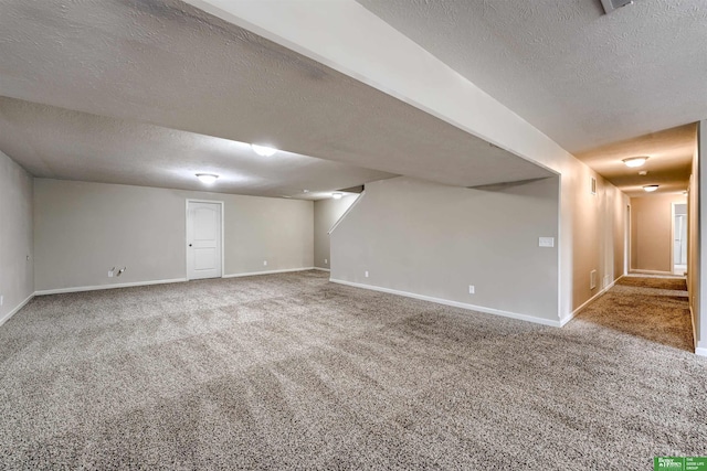 4604 Hansen Ave, Papillion, NE 68133 - finished basement featuring a textured ceiling, carpet, and baseboards