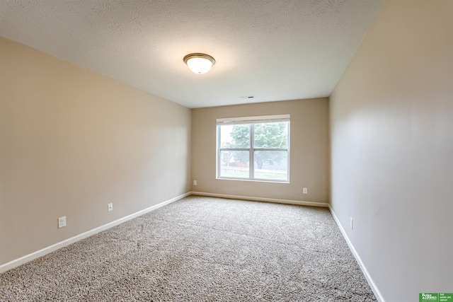 4604 Hansen Ave, Papillion, NE 68133 - spare room with carpet flooring, baseboards, and a textured ceiling