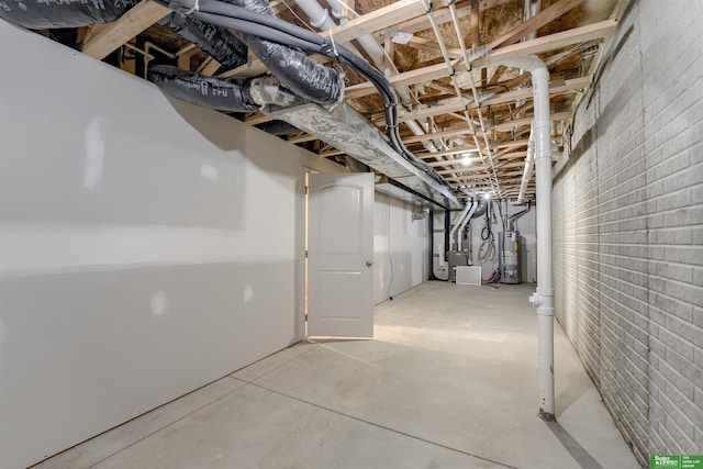 4604 Hansen Ave, Papillion, NE 68133 - unfinished basement with gas water heater, heating unit, and brick wall