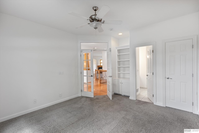 14906 Hanover St, Bennington, NE 68007 - unfurnished bedroom with carpet flooring, baseboards, recessed lighting, arched walkways, and ceiling fan