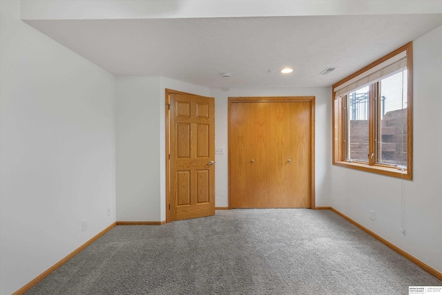 14906 Hanover St, Bennington, NE 68007 - unfurnished bedroom with baseboards, carpet flooring, a closet, and recessed lighting