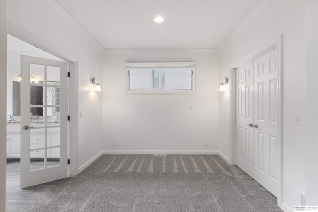 14906 Hanover St, Bennington, NE 68007 - unfurnished bedroom with ornamental molding, baseboards, carpet, a closet, and french doors