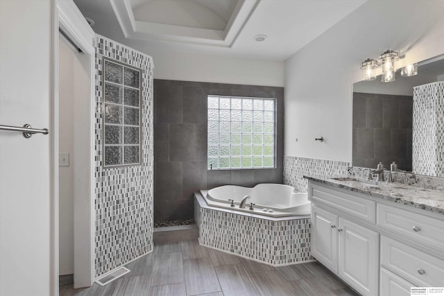 14906 Hanover St, Bennington, NE 68007 - bathroom with a bath, vanity, tile walls, and walk in shower