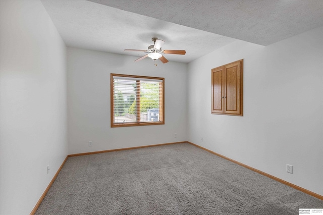 14906 Hanover St, Bennington, NE 68007 - empty room with carpet floors, ceiling fan, baseboards, and a textured ceiling