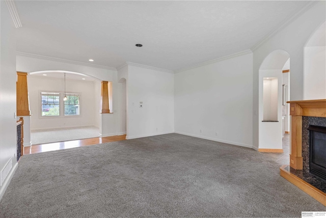14906 Hanover St, Bennington, NE 68007 - unfurnished living room featuring a fireplace, ornamental molding, carpet floors, arched walkways, and baseboards