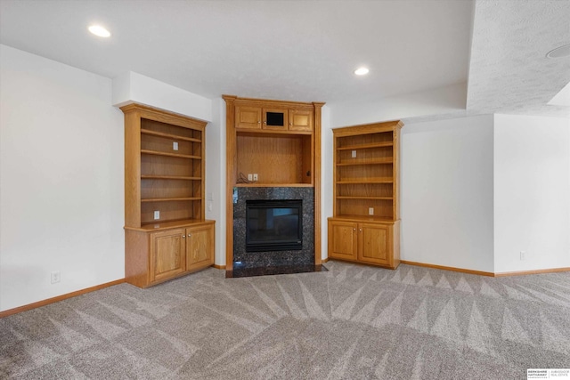 14906 Hanover St, Bennington, NE 68007 - unfurnished living room with a premium fireplace, carpet floors, baseboards, and recessed lighting