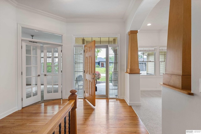 14906 Hanover St, Bennington, NE 68007 - entrance foyer featuring french doors, ornamental molding, light wood-type flooring, and baseboards