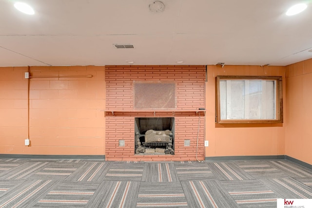 4714 Parker St, Omaha, NE 68104 - unfurnished living room featuring baseboards, carpet, a brick fireplace, and recessed lighting
