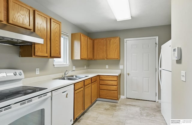 1502 Florence Blvd, Omaha, NE 68110 - kitchen with white appliances, under cabinet range hood, a sink, and light countertops