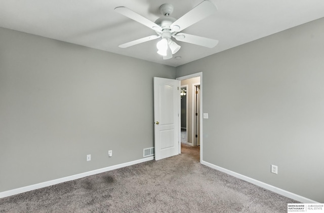 1502 Florence Blvd, Omaha, NE 68110 - unfurnished bedroom featuring carpet floors, baseboards, and ceiling fan