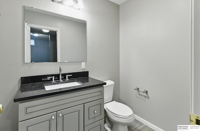1502 Florence Blvd, Omaha, NE 68110 - half bathroom with toilet, vanity, and baseboards