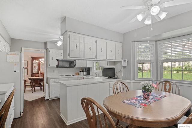 2106 S 145th Ave, Omaha, NE 68144 - dining space featuring ceiling fan and dark wood-style floors